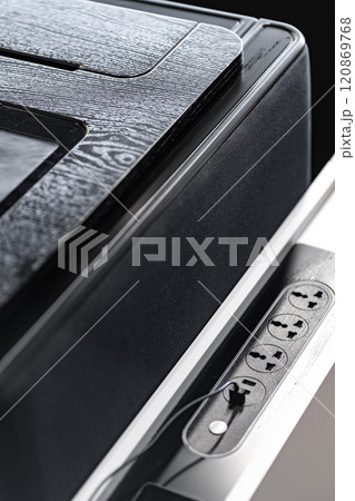 Mobile phone with wireless charger on table. Modern workplace accessory 120869768