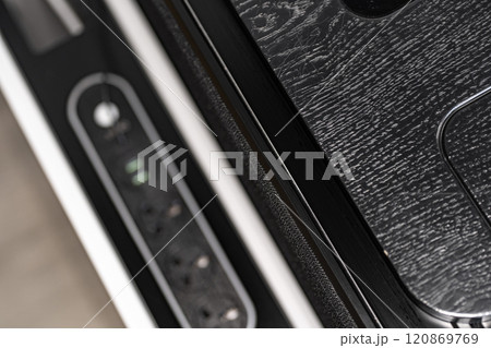 Mobile phone with wireless charger on table. Modern workplace accessory 120869769