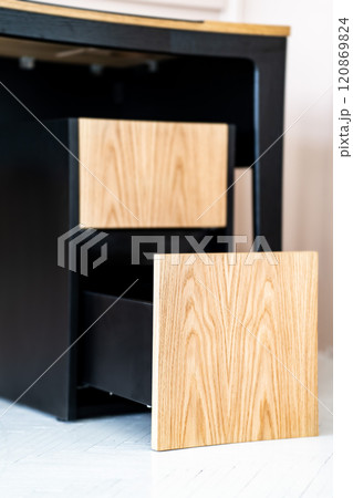 Opened drawer cabinet furniture wooden table at workplace Opened drawer cabinet furniture wooden table at workplace 120869824