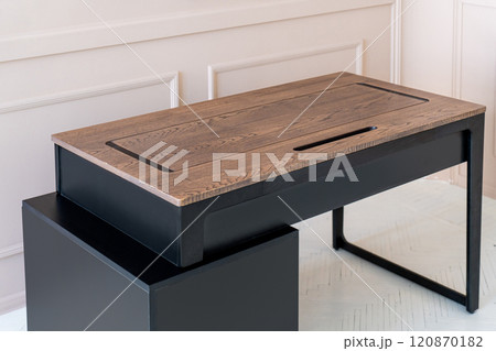 Mobile phone with wireless charger on table. Modern workplace accessory Mobile phone with wireless charger on table. Modern workplace accessory 120870182