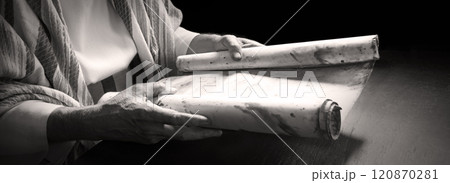 Man's hans holding a scroll Man's hans holding a scroll 120870281