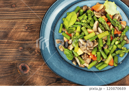 Vegan asparagus and mushroom salad. 120870689