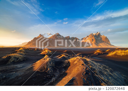 Vestrahorn mountain with black volcanic lava sand dunes at sunset, Stokksnes, Iceland 120872648
