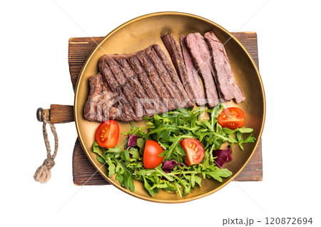 Roast dry aged Top Sirloin beef steak on plate with salad isolated on white background Roast dry aged Top Sirloin beef steak on plate with salad isolated on white background 120872694
