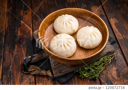 Dumpling Momos with pork meat in wooden plate. wooden background. top view 120872716