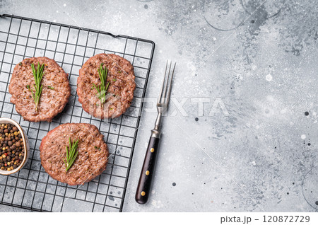 BBQ Grilled burger beef meat cutlets, chooped roast meat. grey background. top view BBQ Grilled burger beef meat cutlets, chooped roast meat. grey background. top view 120872729