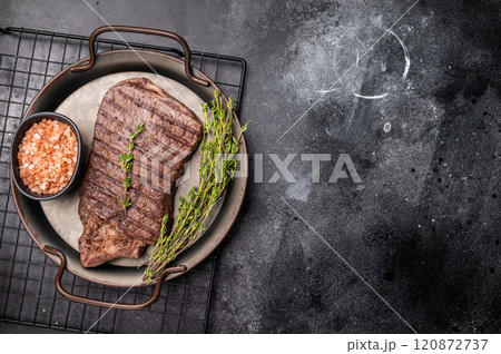 BBQ roasted beef Rump steak on steel tray. black background. top view 120872737