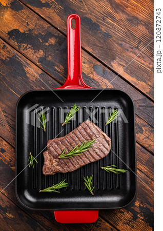 Grilled beef Top sirloin steak or Rump steak in grill pan. wooden background. top view 120872743