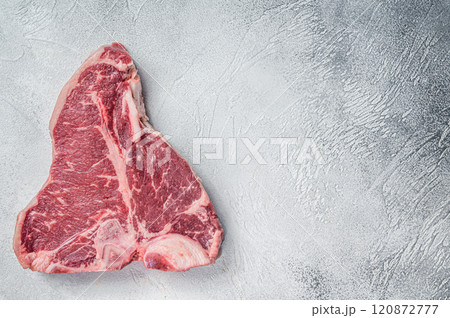 Porterhouse T-bone raw beef meat Steak. White background. Top view. Copy space Porterhouse T-bone raw beef meat Steak. White background. Top view. Copy space 120872777