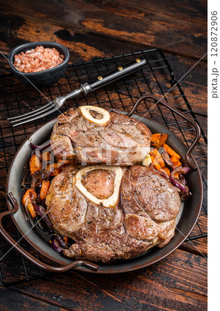 Veal shank stew Osso Buco, italian ossobuco meat steak. Wooden background. Top view 120872906