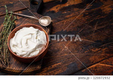 Dip sauce with Fresh Sour cream in a bowl. wooden background. top view 120872932