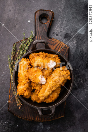 Fried chicken fillet tender strips. wooden background. top view 120872945