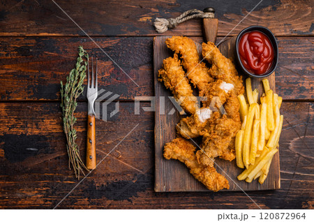 Homemade Deep Fried chicken strips, breast fillet on wooden board. wooden background. top view 120872964