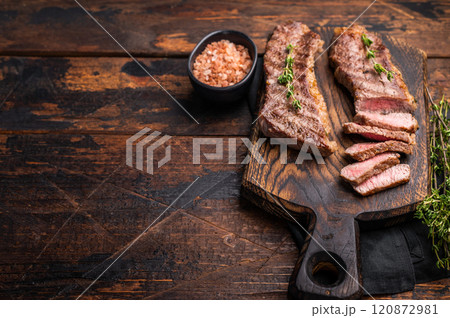 Grilled Tri Tip Steak from Black Angus beef meat. wooden background. top view 120872981