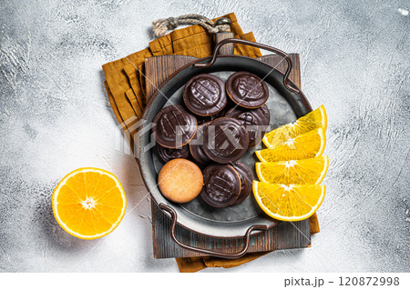 Orange Flavored Round Jaffa Cakes with Chocolate. White background. Top view 120872998