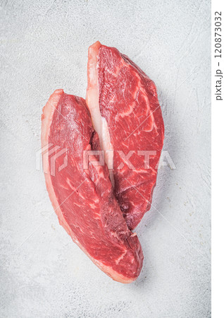 Raw top sirloin steak, cap rump beef meat steak. White background. Top view 120873032