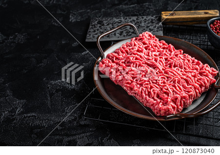 Raw beef and lamb Minced Meat, fresh ground meat. Black background. Top view. Space for text Raw beef and lamb Minced Meat, fresh ground meat. Black background. Top view. Space for text 120873040