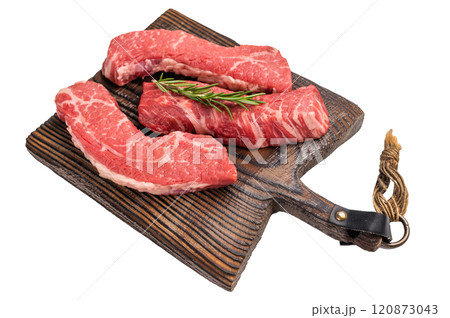 Raw marbled beef Steak, beef meat on wooden board with herbs isolated on white background 120873043