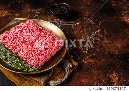 Fresh mutton lamb Mince Meat, raw ground meat. Dark background. Top view. Space for text Fresh mutton lamb Mince Meat, raw ground meat. Dark background. Top view. Space for text 120873107