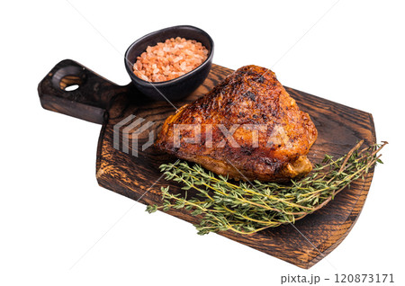 Oven Baked chicken thigh with spices and herb on wooden board isolated on white background. top view 120873171