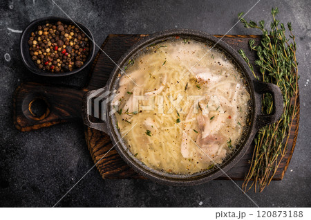 Chicken noodle soup with Vermicelli and meat in a bowl. black background. top view 120873188
