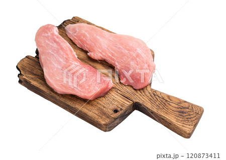 Raw pork fillet steaks, loin chops on a wooden board isolated on white background. top view 120873411