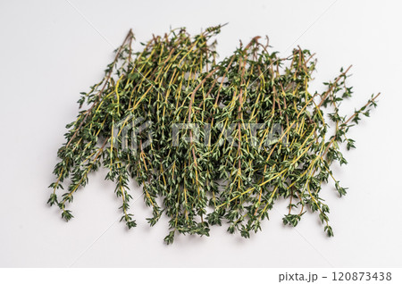 Fresh thyme sprigs bunch isolated on white background. top view Fresh thyme sprigs bunch isolated on white background. top view 120873438