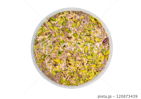 Turkish Halva with tahini and pistachio isolated on a white background. top view Turkish Halva with tahini and pistachio isolated on a white background. top view 120873439