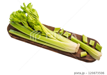 Raw uncooked celery sticks on wooden cutting board isolated on white background, top view 120873506