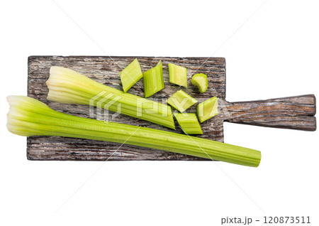 Sliced uncooked celery sticks on wooden cutting board isolated on white background, top view Sliced uncooked celery sticks on wooden cutting board isolated on white background, top view 120873511