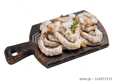 Raw shrimps, headless fresh prawns on a wooden board isolated on white background. Raw shrimps, headless fresh prawns on a wooden board isolated on white background. 120873515