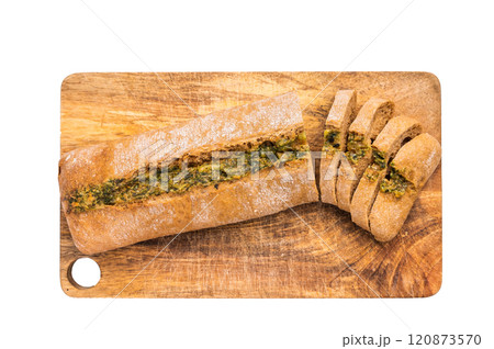 Garlic bread with herbs on wooden cutting board isolated on white background Garlic bread with herbs on wooden cutting board isolated on white background 120873570