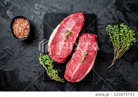 Raw wagyu oyster top blade steaks, organic beef meat. Black background. Top View Raw wagyu oyster top blade steaks, organic beef meat. Black background. Top View 120873733