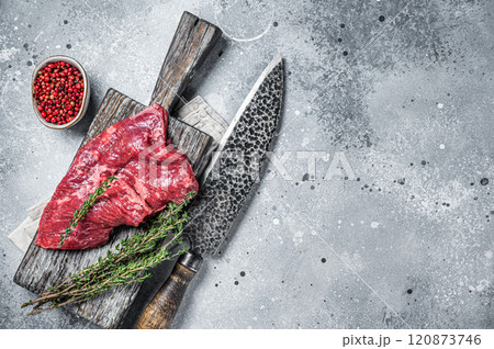 Skirt or Machete beef steak, raw meat with herbs and spices. Gray background. Top view. Copy space Skirt or Machete beef steak, raw meat with herbs and spices. Gray background. Top view. Copy space 120873746