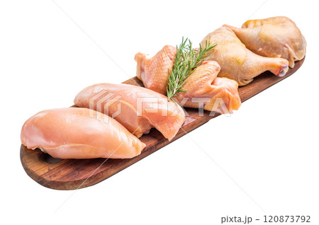 Fresh, raw chicken breasts and legs on a wooden board, isolated on white background 120873792