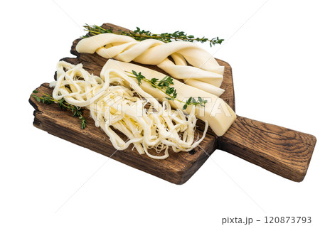 Assortiment of Traditional Caucasian Chechil white cheese isolated on white background. Assortiment of Traditional Caucasian Chechil white cheese isolated on white background. 120873793