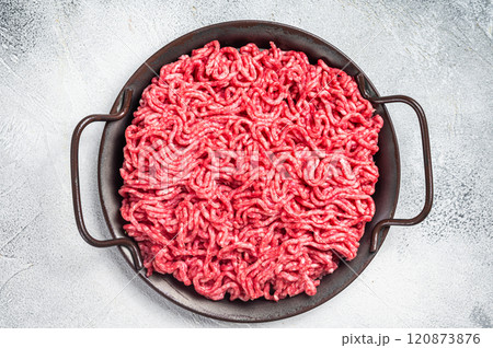 Raw Mince Ground meat in a kitchen tray. White background. Top view Raw Mince Ground meat in a kitchen tray. White background. Top view 120873876