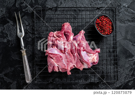 Raw Turkey sliced fillet meat ready for cooking. Black background. Top view 120873879