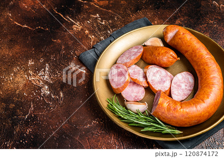 Polish Smoked sausage in a steel plate. Dark background. Top view. Copy space Polish Smoked sausage in a steel plate. Dark background. Top view. Copy space 120874172