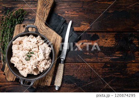 Cod liver Spread with oil in a skillet. Wooden background. Top view. Copy space Cod liver Spread with oil in a skillet. Wooden background. Top view. Copy space 120874295