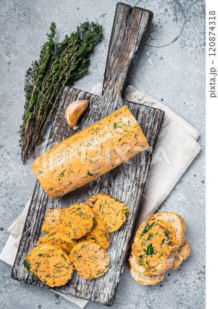 Herb Butter with Chives, Basil, Oregano, Parsley and garlic. Gray background. Top view 120874318