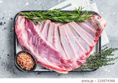 Ready for cooking Rack of lamb, raw mutton ribs with herbs. Gray background. Top view Ready for cooking Rack of lamb, raw mutton ribs with herbs. Gray background. Top view 120874366