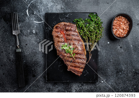 BBQ roasted Shoulder Top Blade or Australia wagyu oyster blade beef steak. Black background. Top View BBQ roasted Shoulder Top Blade or Australia wagyu oyster blade beef steak. Black background. Top View 120874393