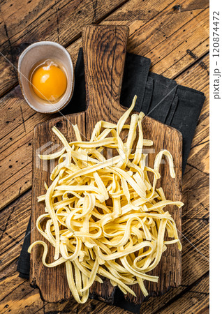 Cooking raw spaetzle egg noodle. Wooden background. Top view 120874472