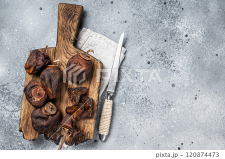 Sun Dried persimmon fruit on wooden board. Gray background. Top view. Copy space Sun Dried persimmon fruit on wooden board. Gray background. Top view. Copy space 120874473
