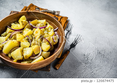 Bowl of warm potato salad with bacon, German Kartoffelsalat. White background. Top view. Copy space 120874475