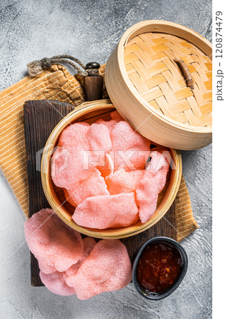 Indonesian prawn shrimp crackers or chips with sauce. White background. Top view 120874479