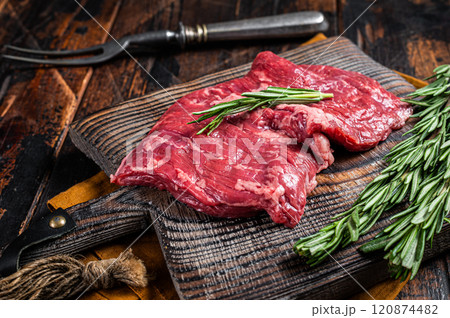 Raw alternative skirt beef steak on butcher board. Wooden background. Top view 120874482