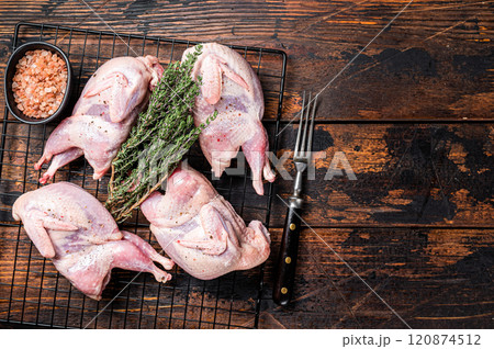 Farm eco friendly raw quails on kitchen table. Wooden background. Top view. Copy space 120874512