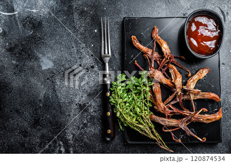 Chinese food dip fried duck tongue Black background. Top view. Copy space 120874534